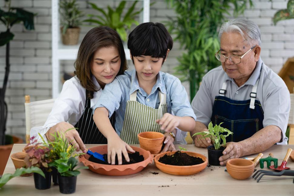 Free Image of Happy family gardening together in the garden 
