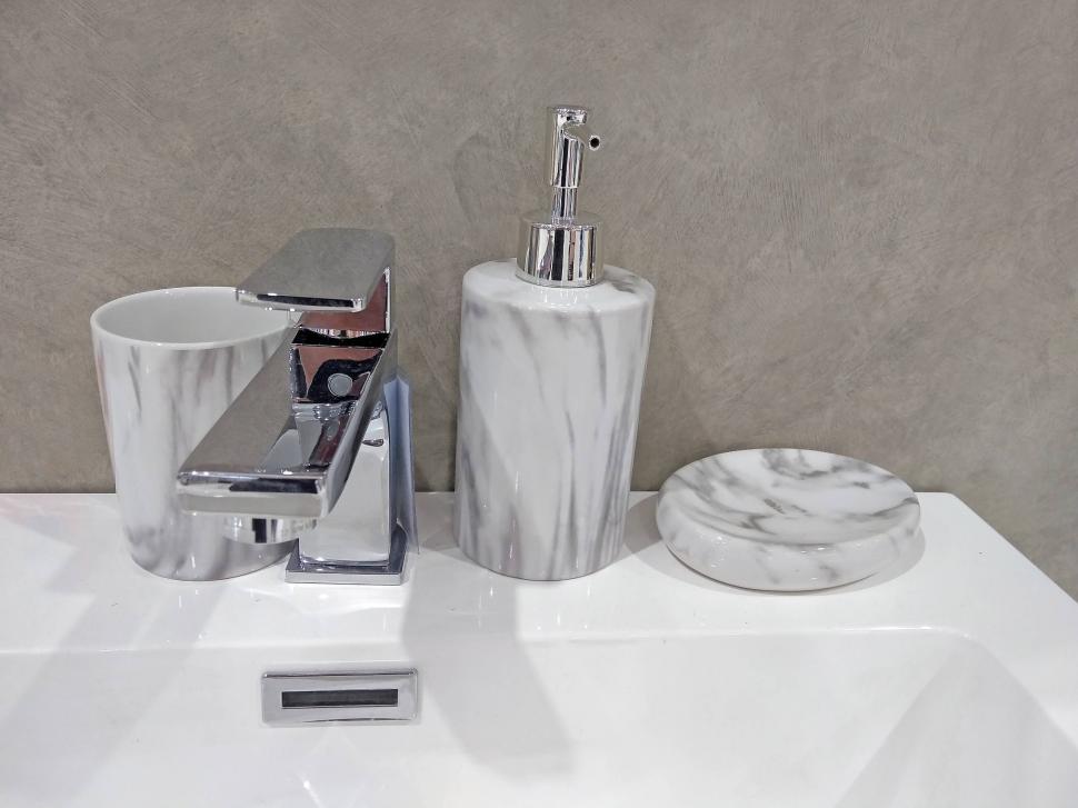 Free Image of Tap, sink and bathroom soap dispenser  