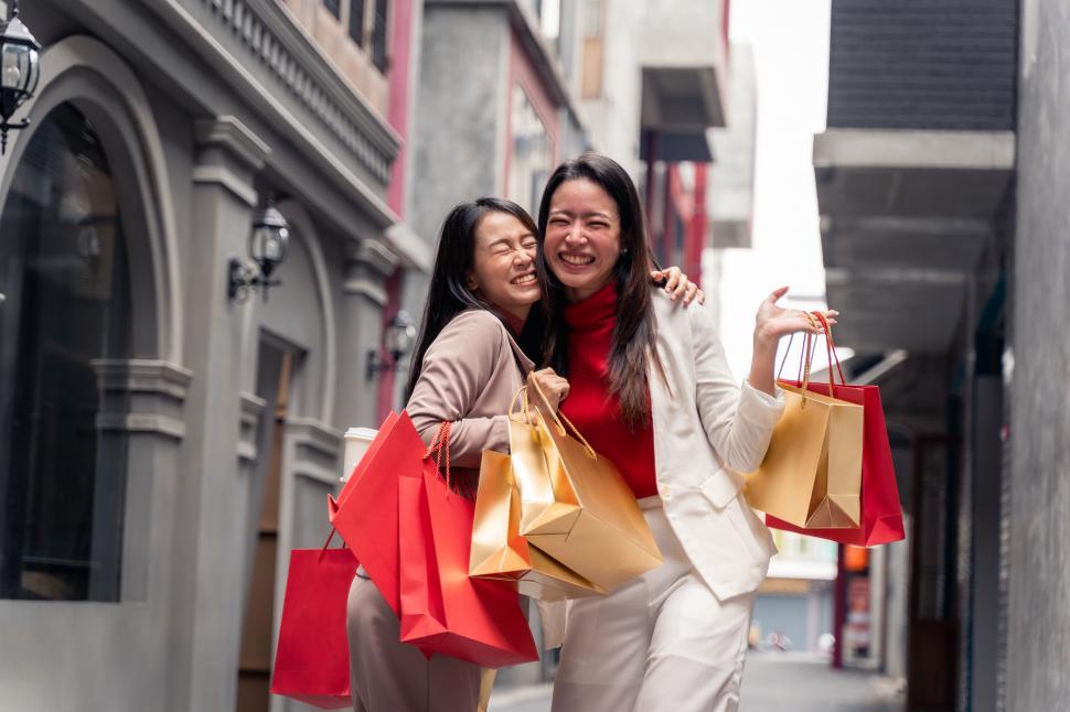Free Image of Two asian women shopping in the city 