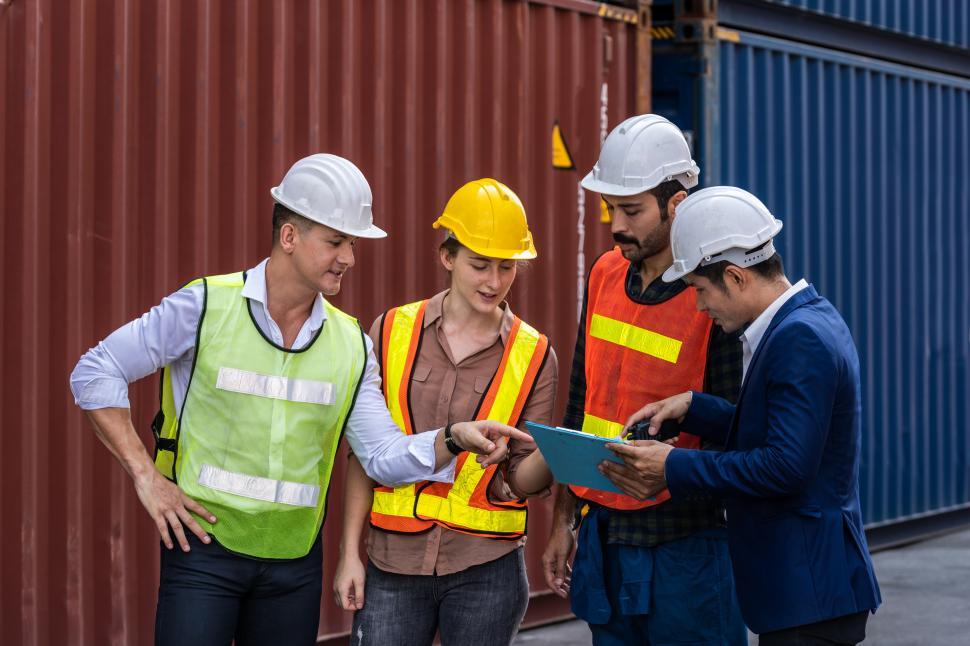 Free Image of Group of staff worker standing and checking the containers box 
