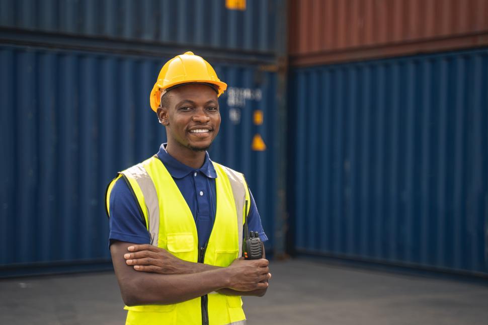 Download Free Stock Photo of Happy worker standing in the container workplace 