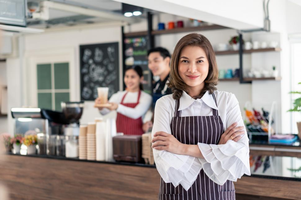 Download Free Stock Photo of Female coffee shop owner, looking at camera 