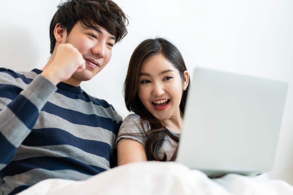Free Image of Portrait of asian couple shopping online 