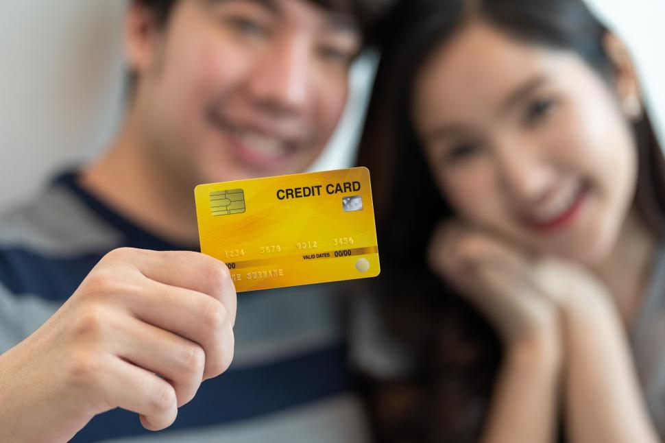 Free Image of Couple showing credit card 