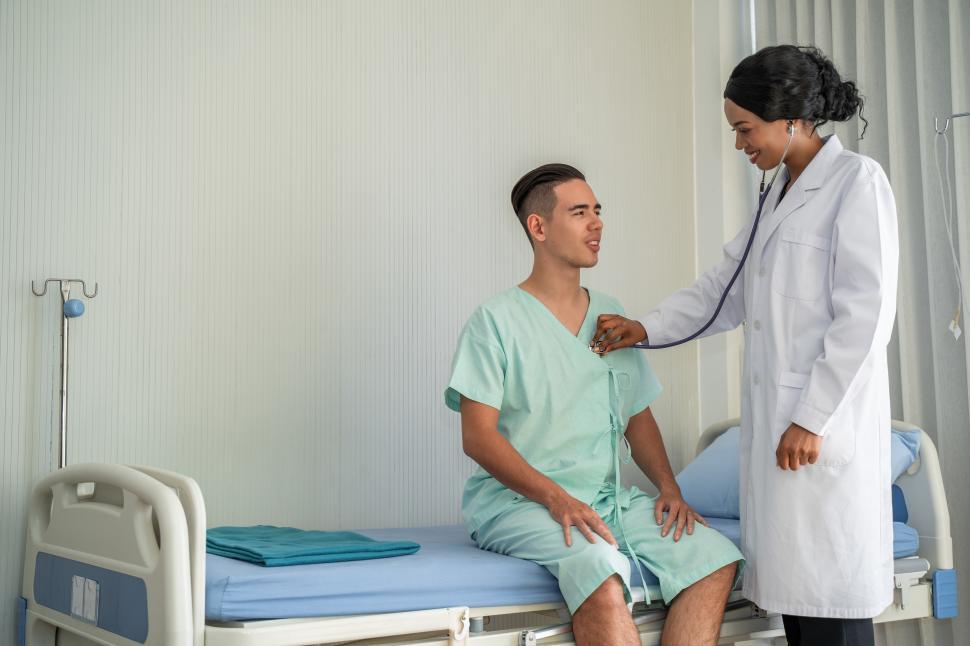 Free Image of Doctor is examining a patient in at the hospital 