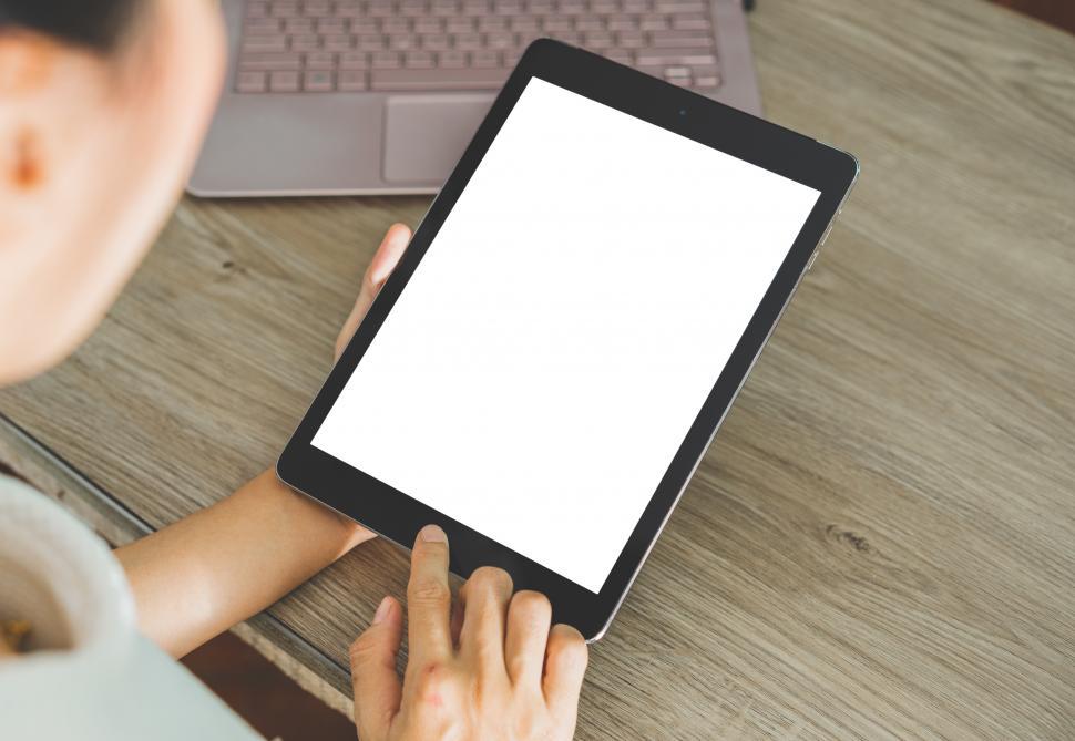 Free Image of Women holding Tablet with blank screen 