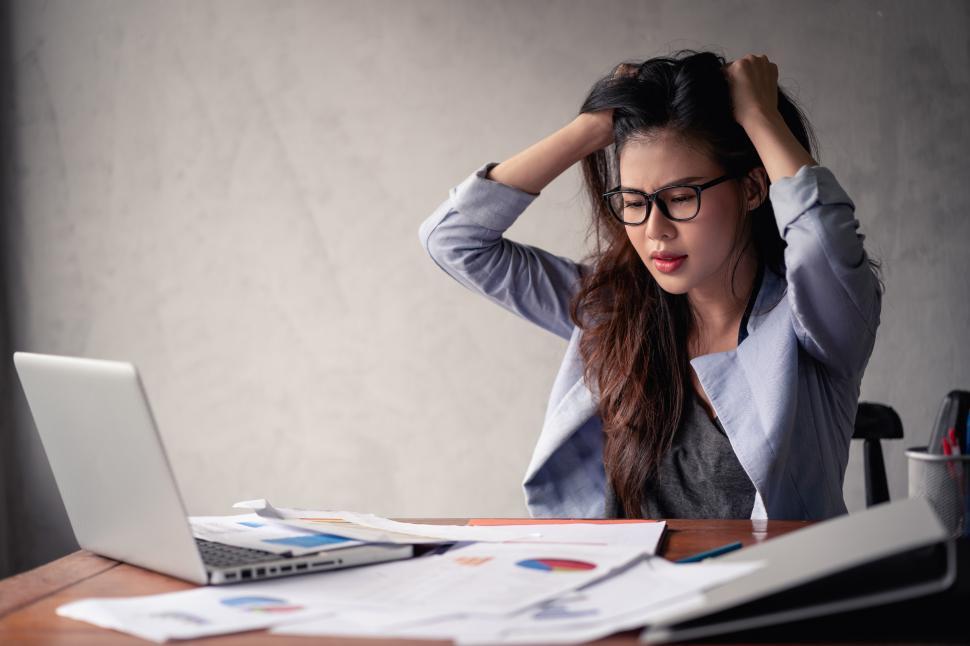 Free Image of Stressed business woman working 
