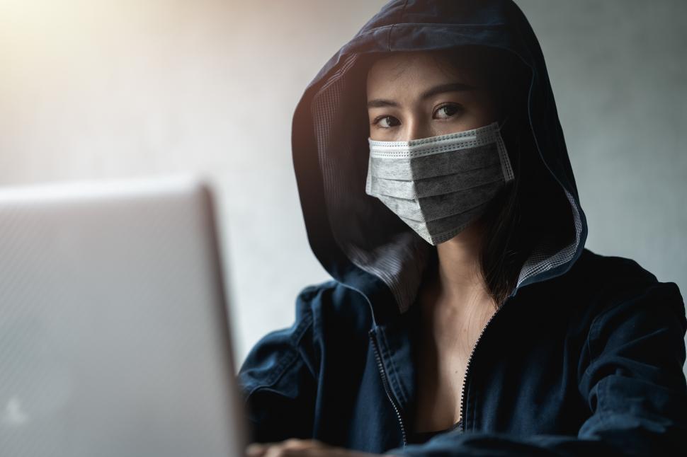 Free Image of Dangerous Hooded Hacker using computer 
