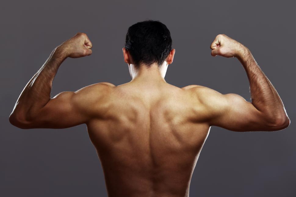 Free Image of Young muscular guy over gray background 