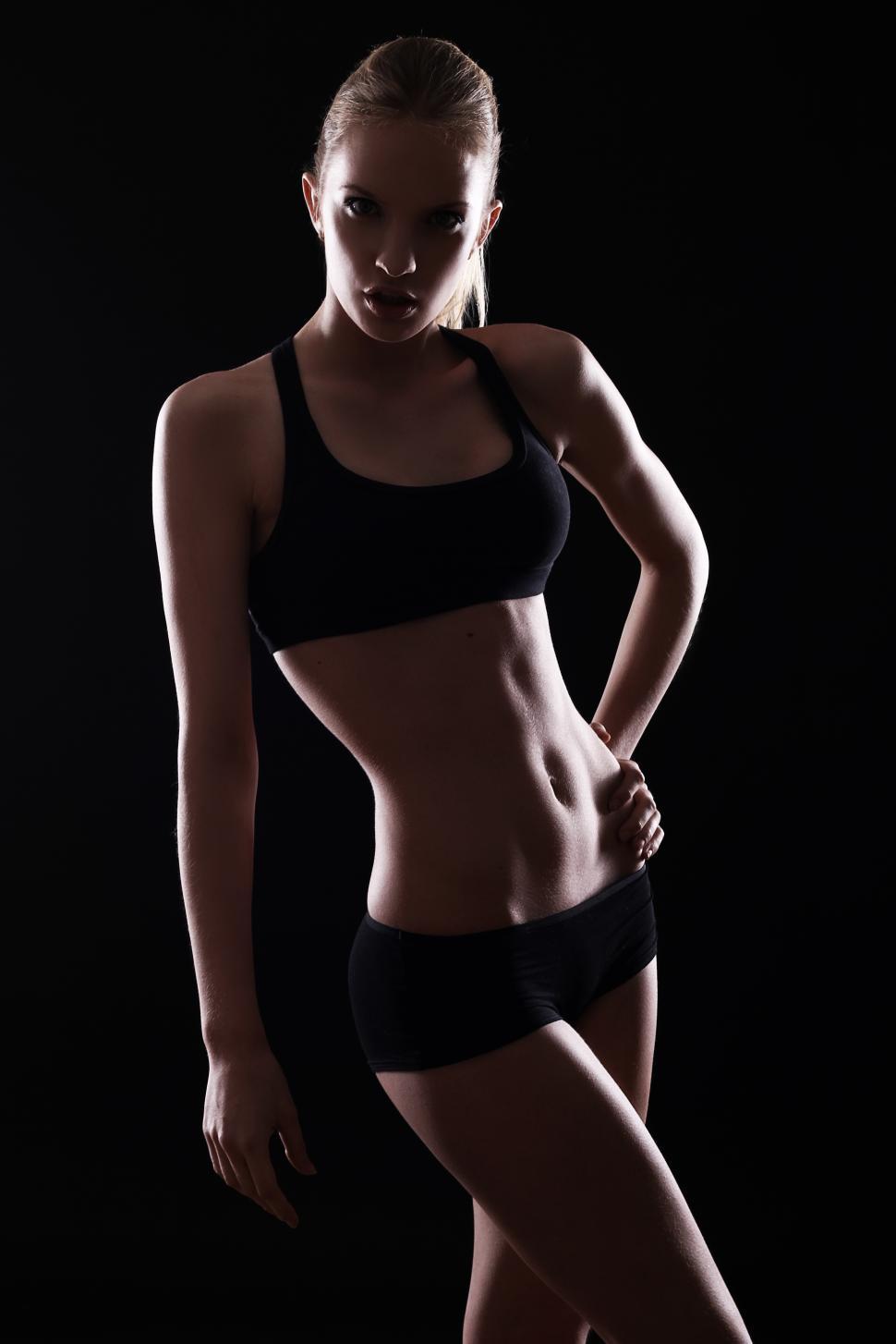 Free Image of Fit woman in dramatic light 