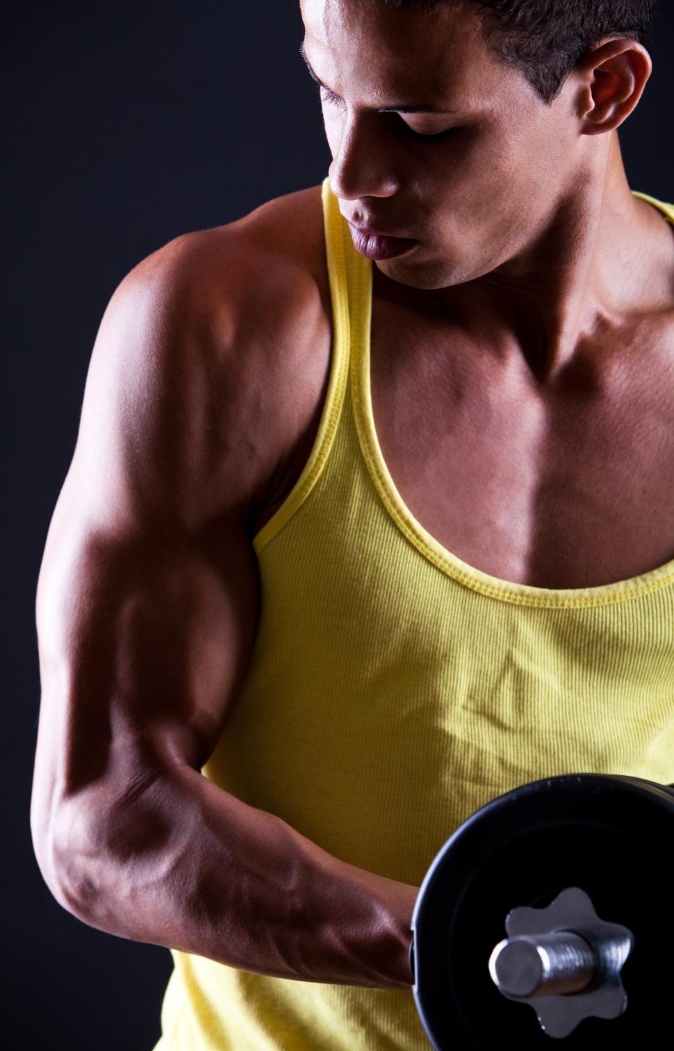 Free Image of Strong and muscular guy with dumbbell 