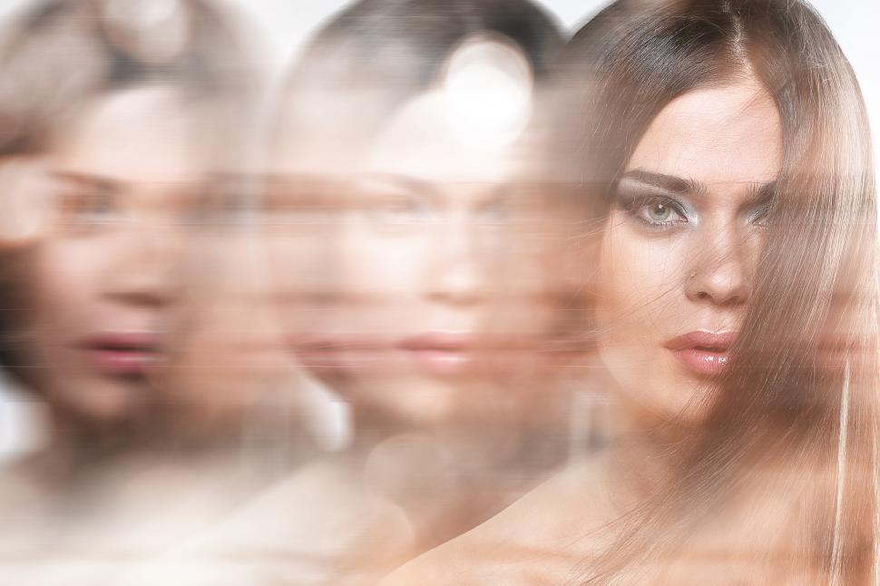 Free Image of Blurred composite of multiple images of a woman 