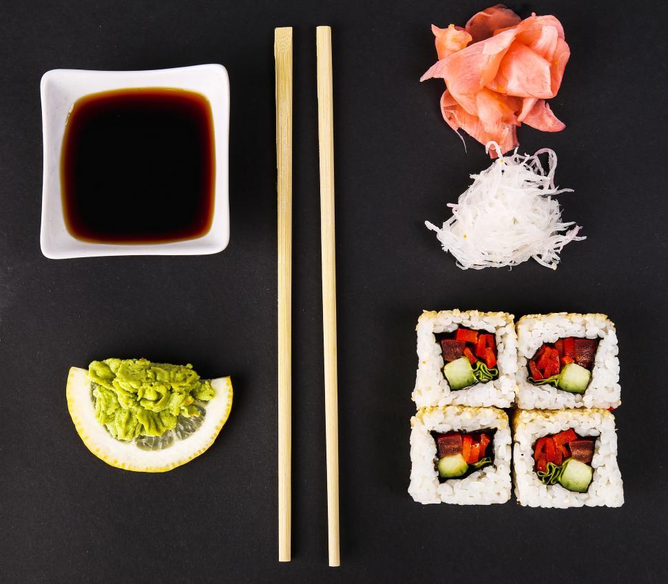 Free Image of Delicious sushi and utensils  
