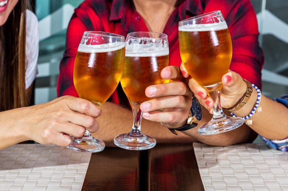 Free Image of Hands clinking beer 