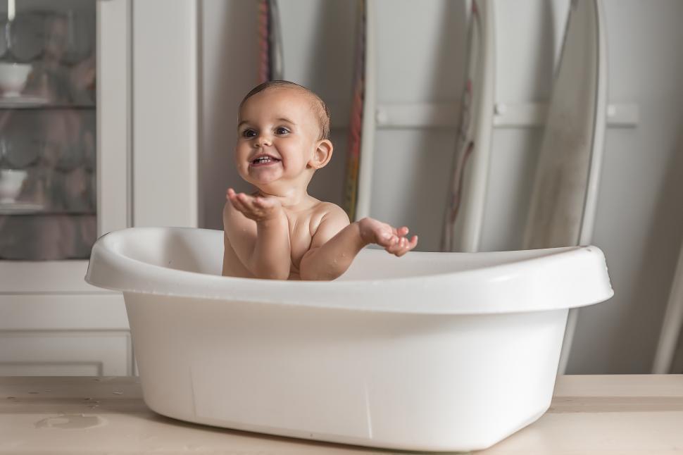 Download Free Stock Photo of Baby smiling in the bathtub 