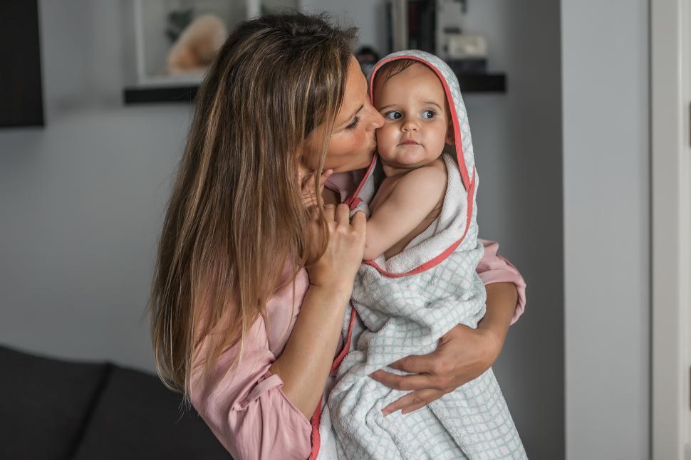 Download Free Stock Photo of Mother kissing her baby after bath 