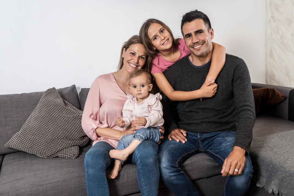 Download Free Stock Photo of Happy family on the couch at home 