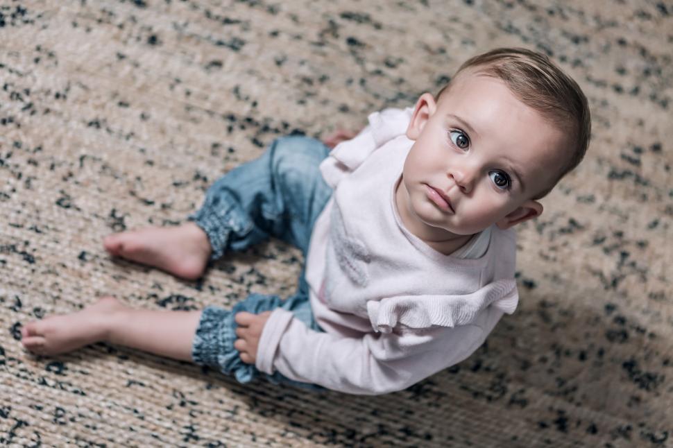 Download Free Stock Photo of Toddler girl sitting in the lounge 