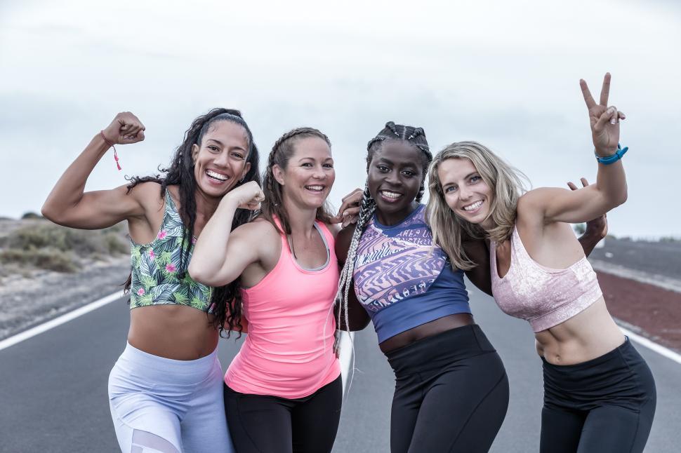 Download Free Stock Photo of Happy diverse sportswomen gesticulating and smiling 