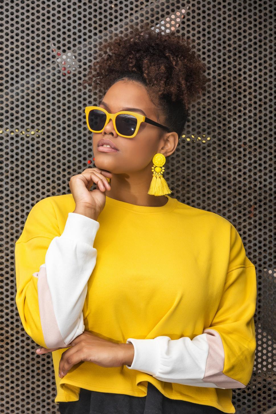 Free Image of Stylish black woman in yellow outfit 