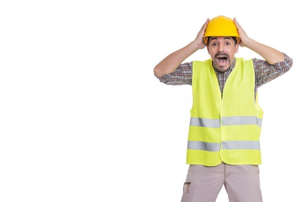 Free Image of Panicking male engineer standing on white background 