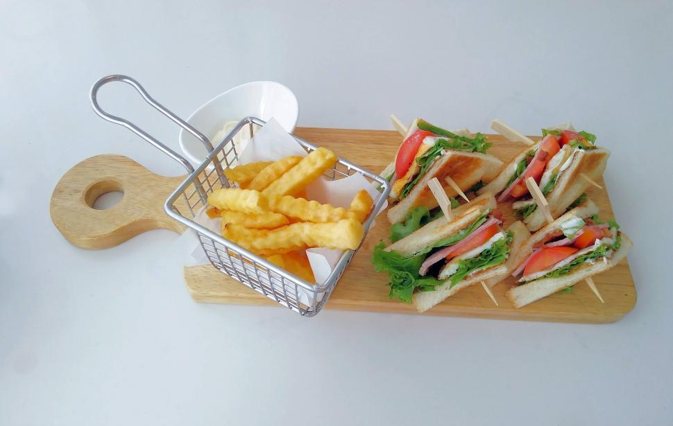 Free Image of Club sandwich with French fries  