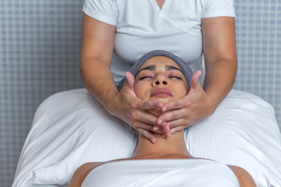 Download Free Stock Photo of Esthetician performing a facial massage 