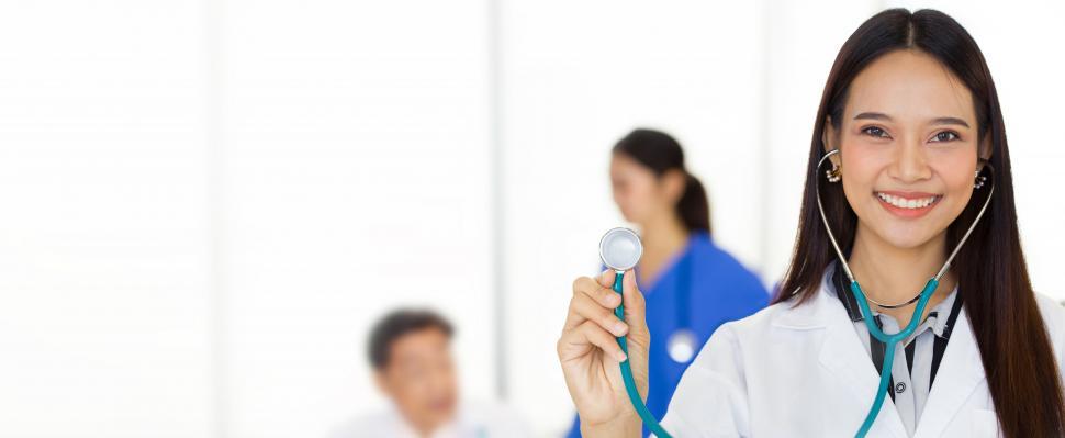 Free Image of Woman doctor smiling with a stethoscope. 