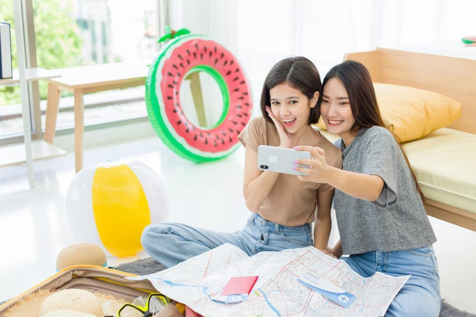 Free Image of Two women taking selfie with a mobile phone. 