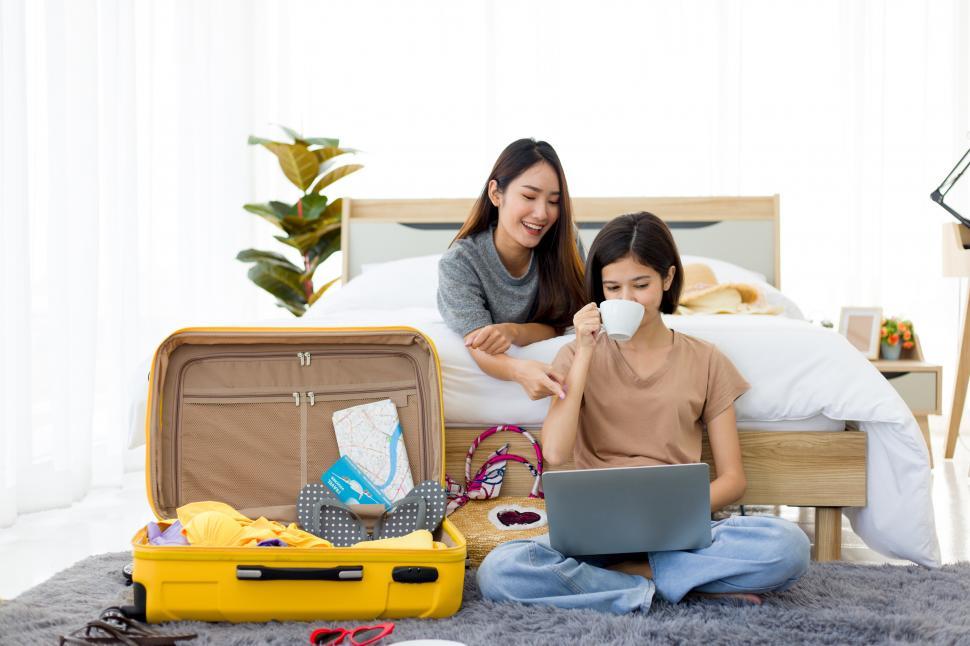 Free Image of Young Asian women planning a journey trip in summer. 