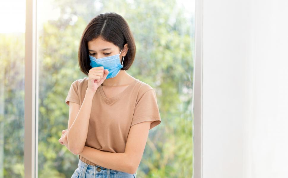 Free Image of Coughing young woman is feeling sick. 