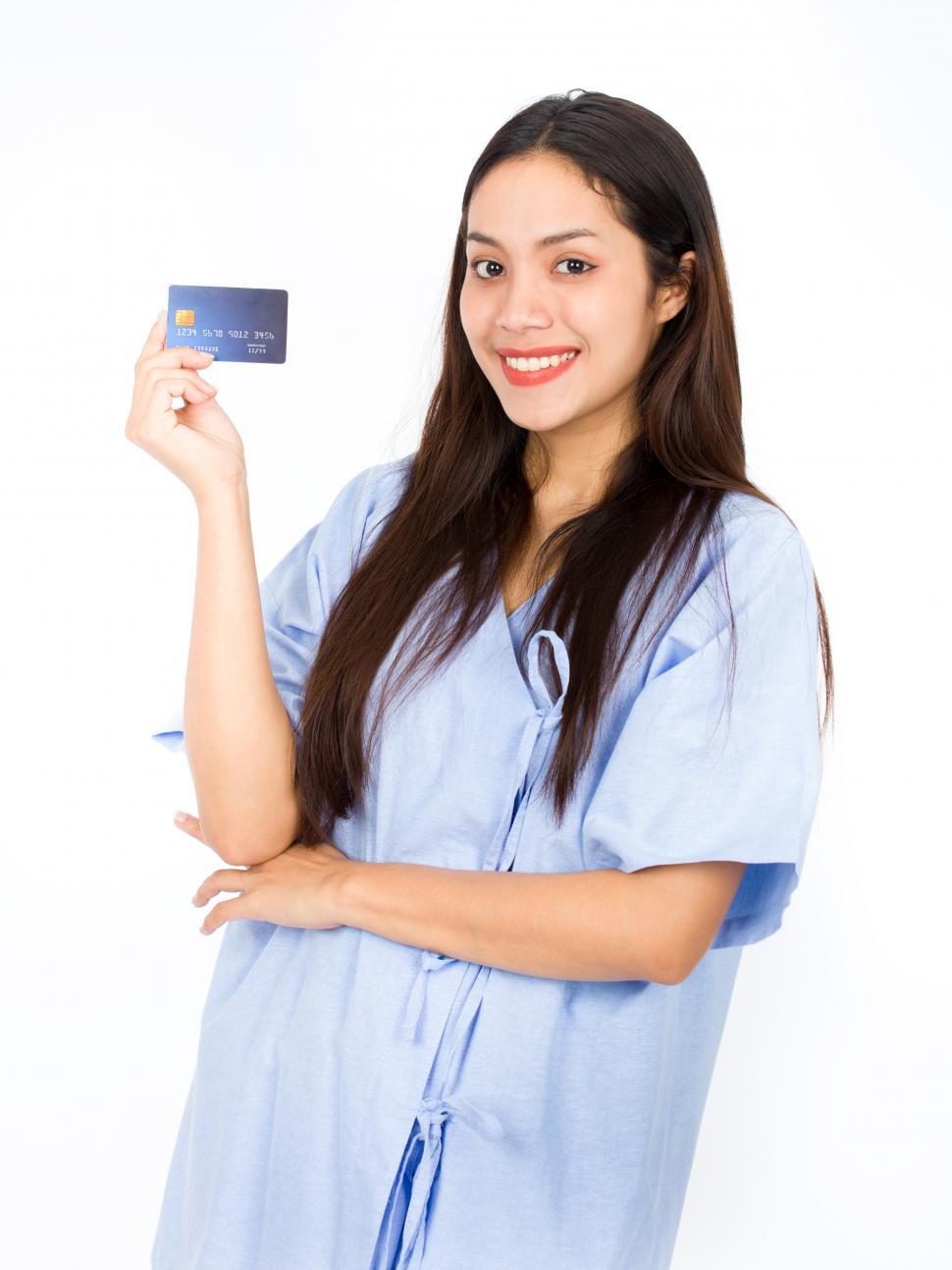 Free Image of Female patient with health insurance care card. 