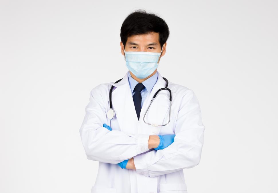 Download Free Stock Photo of Portrait of Doctor standing arms crossed 