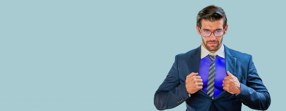 Free Image of Strong businessman superhero wearing blue suit and glasses 