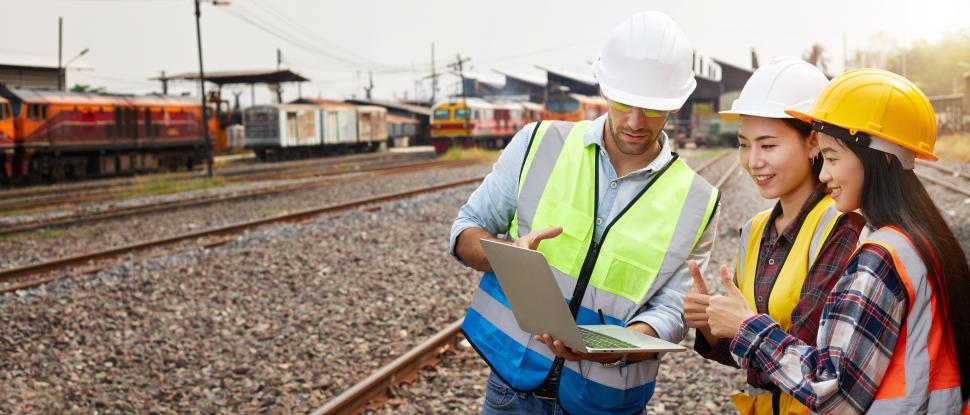 Download Free Stock Photo of Rail logistics engineers are meeting on the train track. 