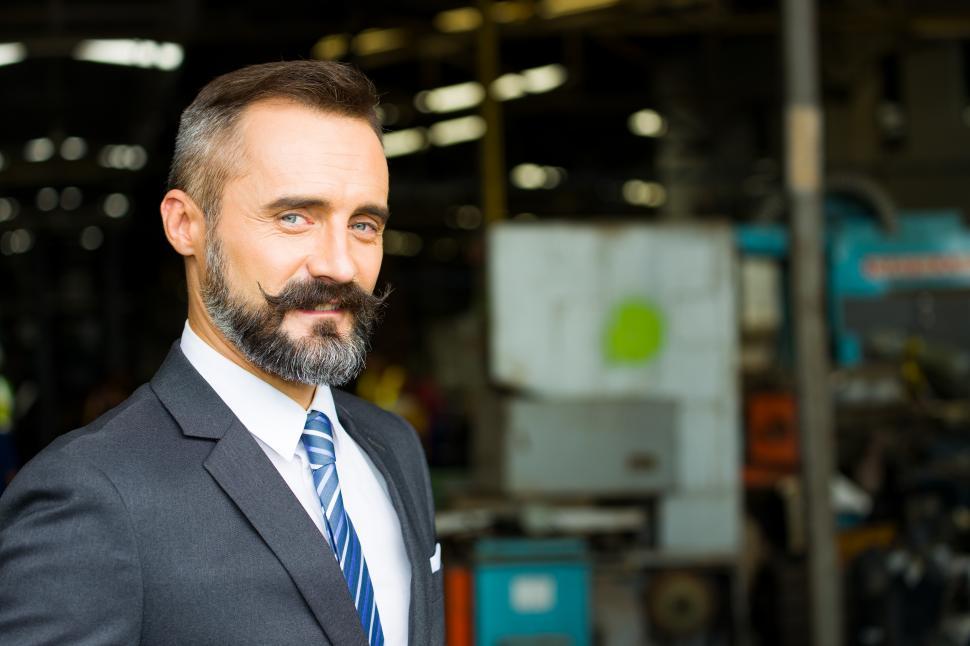 Free Image of Portrait of Handsome bearded factory owner. 