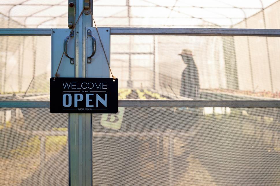 Download Free Stock Photo of Greenhouse growing organic vegetables with an Open sign 