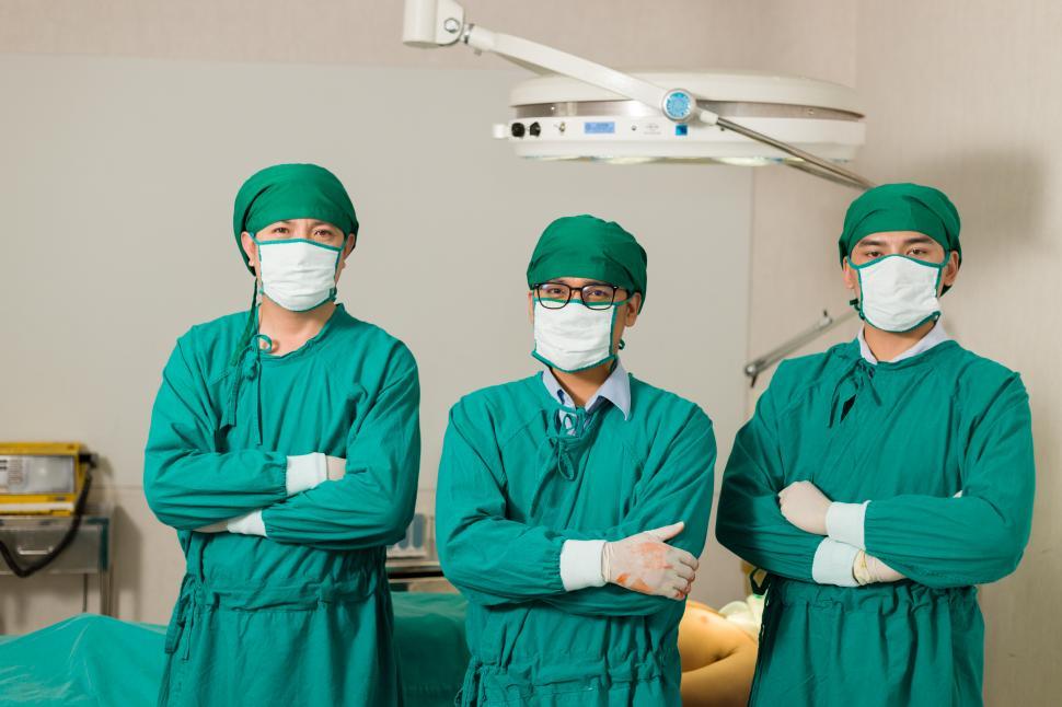 Download Free Stock Photo of Surgeon or doctor standing and crossed arms in the operating room 