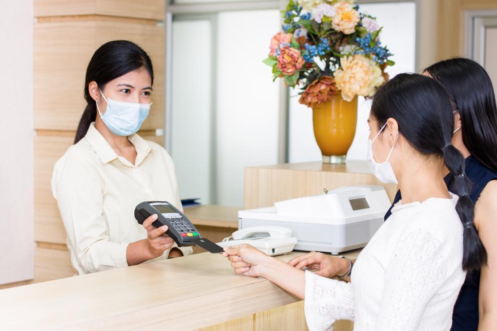 Download Free Stock Photo of Paying for services by credit card at the hospital 