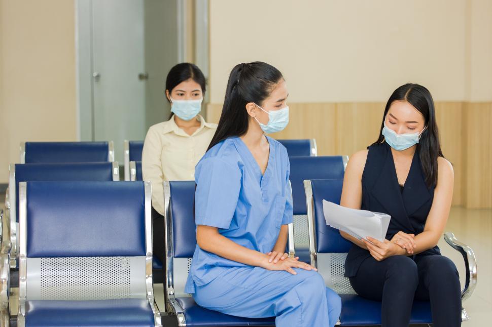 Download Free Stock Photo of The medical staff is proposing a treatment plan for the patient. 