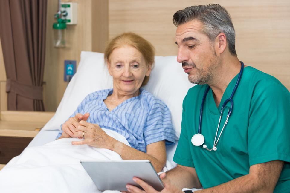 Free Image of Physician and elderly women with a tablet device 