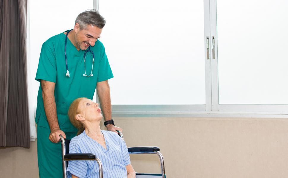 Download Free Stock Photo of Nurse cares for elderly patient 