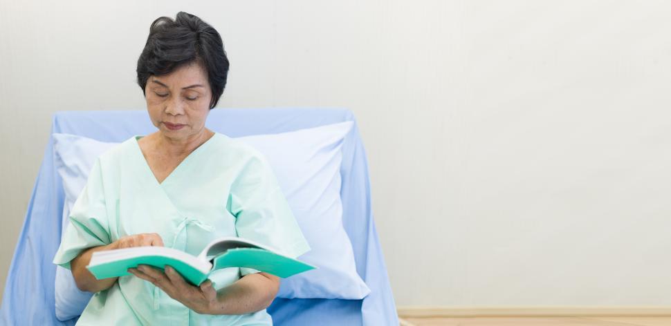 Free Image of Female patient reading a book. 