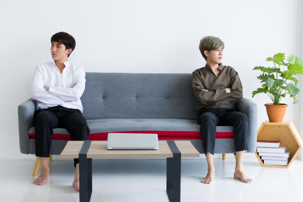 Free Image of Gay couple bored and upset after argument 