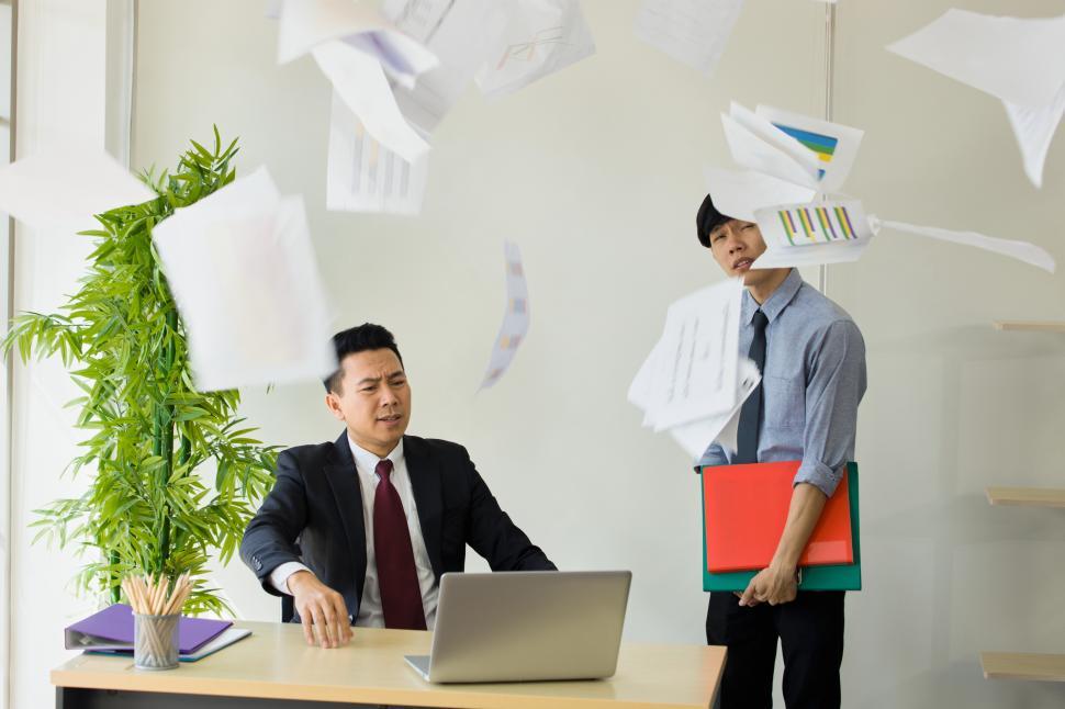 Download Free Stock Photo of Furious employer throws documents 