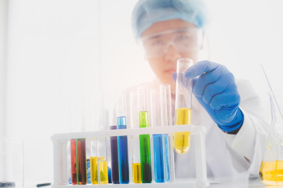 Free Image of Researchers look at multicolor test tubes 