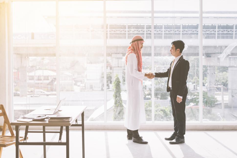 Free Image of Arab businessmen meeting with with Asian businessmen 