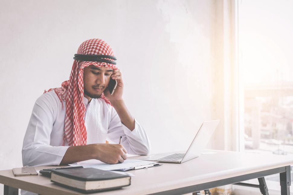 Free Image of Arab young man talking on the phone 