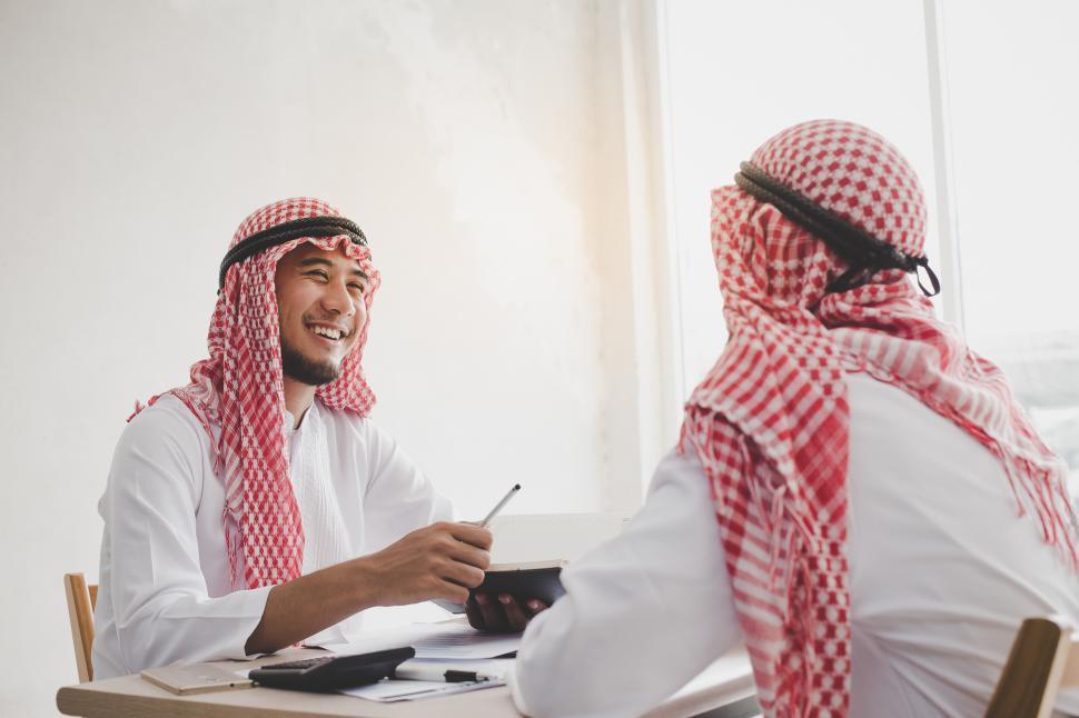 Free Image of Business meeting - Young Arab businessman discussing ideas 