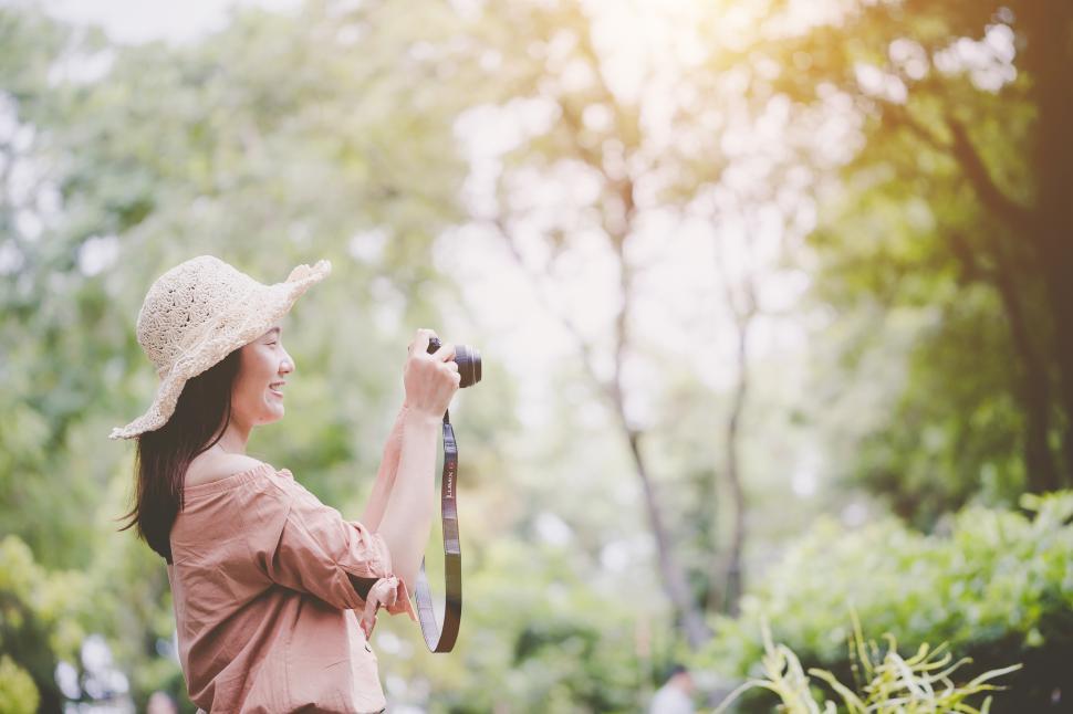 Free Image of Woman photographing natural scenes 